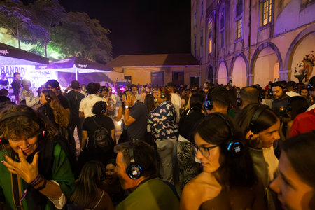 FARO, PORTUGAL: 5th SEPTEMBER, 2024 - Audience enjoying music in headphones on Festival F, a silent disco concept.のeditorial素材