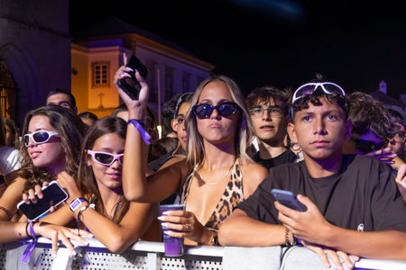 FARO, PORTUGAL: 5th SEPTEMBER, 2024 - Audience watch music artist in the Music Festival F, a big festival on the city of Faro, Portugalのeditorial素材