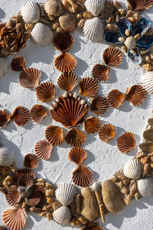 Close up view of a collection of artwork encrusted with seashells.のeditorial素材