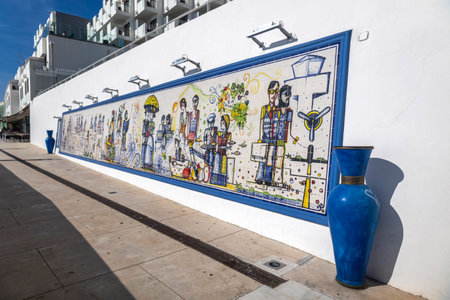 ALBUFEIRA, PORTUGAL - 9th NOVEMBER 2024: Historical artwork in azulejo depicting the history of Albufeira city throughout the centuries.のeditorial素材