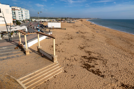 ARMACAO DE PERA, PORTUGAL - 9th NOVEMBER 2024: Landscape view of the coast of Armacao de Pera, located in the Algarve region, Portugal.のeditorial素材