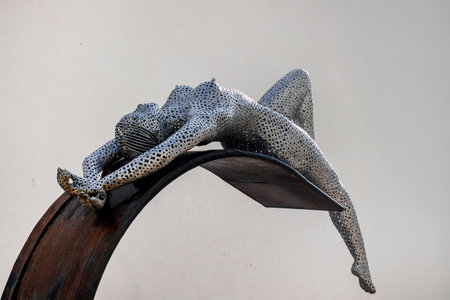 ARMACAO DE PERA, PORTUGAL - 9th NOVEMBER 2024: Metal tubes sculpture of a sensual woman posing in Armacao de Pera, Portugal.のeditorial素材