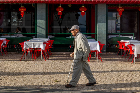 ARMACAO DE PERA, PORTUGAL - 9th NOVEMBER 2024: Close view of a lonely old man walking to watch the ocean.のeditorial素材