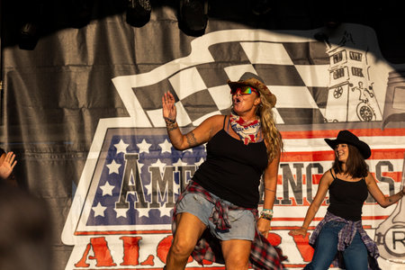 FARO, PORTUGAL, 04th August 2024: American Cars Show Algarve Event with vintage cars and a mix of Americana related activities happen, including pinup shows, rockabilly concerts and dance groups, among others.のeditorial素材