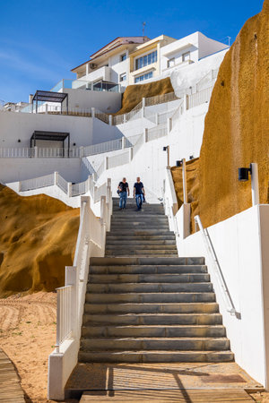 Close view of the stair access to the beach in Albufeira city, Portugal.の写真素材