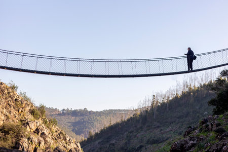 ALFERCE, PORTUGAL - 3rd FEBRUARY 2024: Wooden path, suspended bridge in the mountain used by many hiking tourists, located in Alferce, Monchique, Portugal.のeditorial素材
