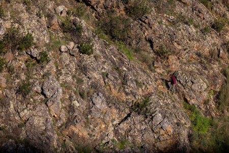 ALFERCE, PORTUGAL - 3rd FEBRUARY 2024: Lost man walking on a steep mountain, located in Alferce, Monchique, Portugal.のeditorial素材