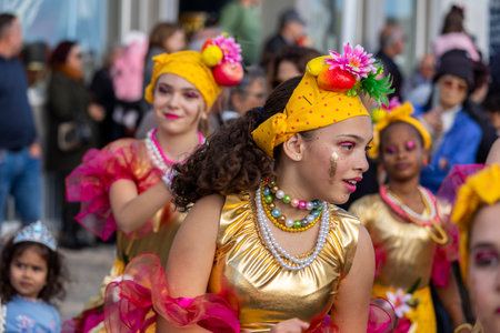 QUARTEIRA, PORTUGAL - 13th FEB 2024: Colorful Carnival (Carnaval) Parade festival participants on Quarteira city, Portugal.のeditorial素材