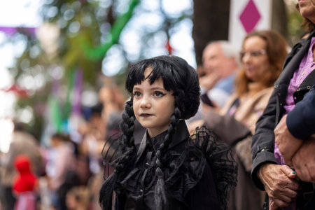 LOULE, PORTUGAL - 17th FEB 2024: Colorful Carnival (Carnaval) Parade festival audience participants on Loule city, Portugal.のeditorial素材