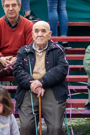 LOULE, PORTUGAL - 17th FEB 2024: Colorful Carnival (Carnaval) Parade festival audience participants on Loule city, Portugal.のeditorial素材