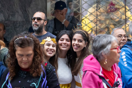 LOULE, PORTUGAL - 17th FEB 2024: Colorful Carnival (Carnaval) Parade festival audience participants on Loule city, Portugal.のeditorial素材