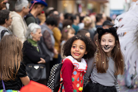 LOULE, PORTUGAL - 17th FEB 2024: Colorful Carnival (Carnaval) Parade festival audience participants on Loule city, Portugal.のeditorial素材