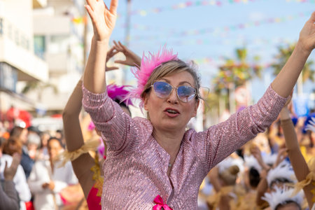 QUARTEIRA, PORTUGAL - 13th FEB 2024: Colorful Carnival (Carnaval) Parade festival participants on Quarteira city, Portugal.のeditorial素材