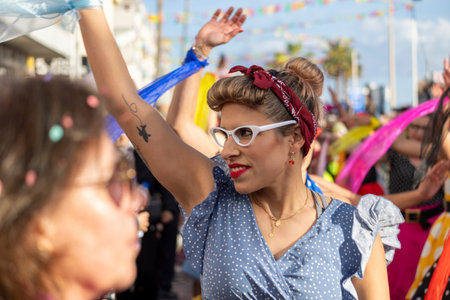 QUARTEIRA, PORTUGAL - 13th FEB 2024: Colorful Carnival (Carnaval) Parade festival participants on Quarteira city, Portugal.のeditorial素材