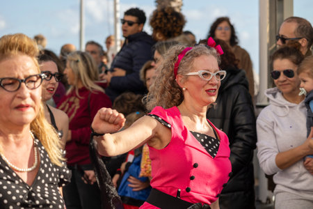 QUARTEIRA, PORTUGAL - 13th FEB 2024: Colorful Carnival (Carnaval) Parade festival participants on Quarteira city, Portugal.のeditorial素材