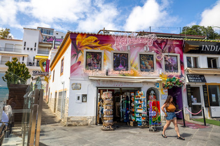 ALBUFEIRA, PORTUGAL - 7th MAY 2024: Albufeira city downtown businesses with tourists having a good time in the bars and restaurants.のeditorial素材