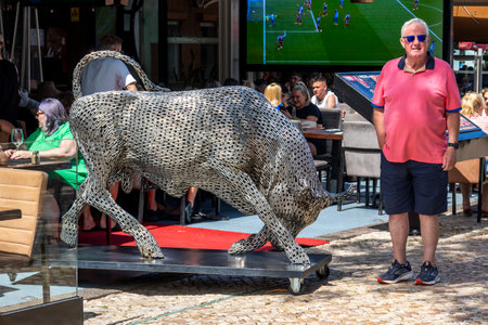ALBUFEIRA, PORTUGAL - 7th MAY 2024: Albufeira city downtown businesses with people walking around.のeditorial素材