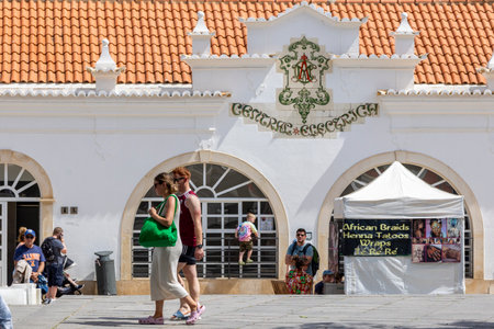 ALBUFEIRA, PORTUGAL - 7th MAY 2024: Albufeira city downtown businesses with tourists having a good time in the bars and restaurants.のeditorial素材