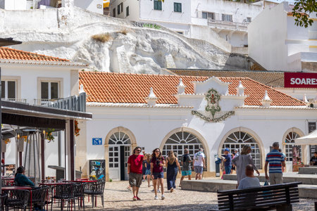 ALBUFEIRA, PORTUGAL - 7th MAY 2024: Albufeira city downtown businesses with tourists having a good time in the bars and restaurants.のeditorial素材