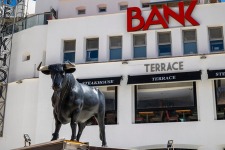 ALBUFEIRA, PORTUGAL - 7th MAY 2024: Albufeira city downtown businesses with people walking around.のeditorial素材