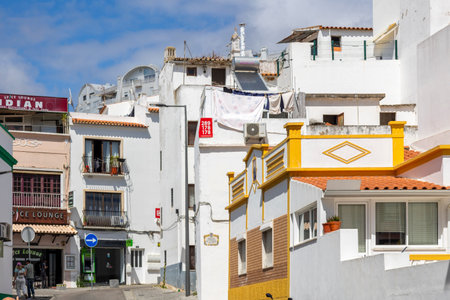 ALBUFEIRA, PORTUGAL - 7th MAY 2024: Traditional portuguese architecture of houses in the region of Albufeira, Portugal.のeditorial素材