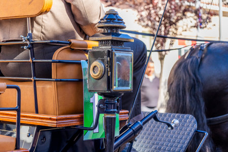 Detail of light on a Carriage coupling traditional event with beautiful carriages with horses and person dressed for the occasion.の写真素材