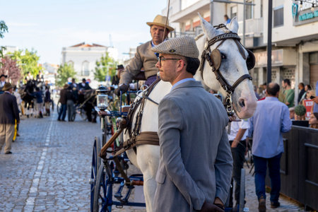 SAO BRAS DE ALPORTE, PORTUGAL - 4th MAY 2024: Period representation event of Carriage coupling traditional event with beautiful carriages with horses and person dressed for the occasion.のeditorial素材