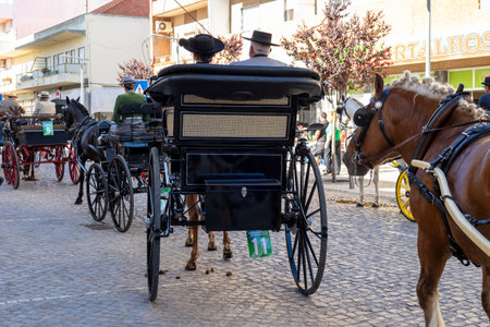SAO BRAS DE ALPORTE, PORTUGAL - 4th MAY 2024: Period representation event of Carriage coupling traditional event with beautiful carriages with horses and person dressed for the occasion.のeditorial素材