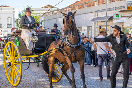SAO BRAS DE ALPORTE, PORTUGAL - 4th MAY 2024: Period representation event of Carriage coupling traditional event with beautiful carriages with horses and person dressed for the occasion.のeditorial素材