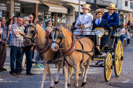 SAO BRAS DE ALPORTE, PORTUGAL - 4th MAY 2024: Period representation event of Carriage coupling traditional event with beautiful carriages with horses and person dressed for the occasion.のeditorial素材