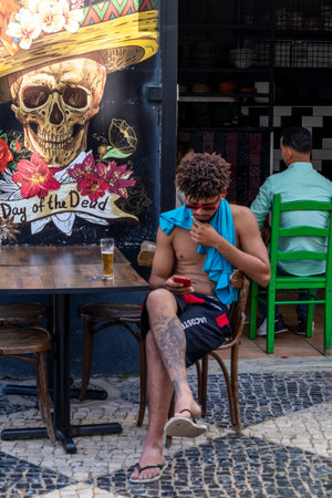 ALBUFEIRA, PORTUGAL - 7th MAY 2024: Albufeira city downtown businesses with tourists having a good time in the bars and restaurants.のeditorial素材