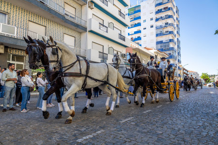 SAO BRAS DE ALPORTE, PORTUGAL - 4th MAY 2024: Period representation event of Carriage coupling traditional event with beautiful carriages with horses and person dressed for the occasion.のeditorial素材