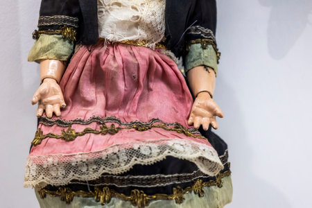 old vintage children puppet with old dress at display on a museum.の写真素材