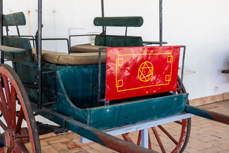 SAO BRAS DE ALPORTEL, PORTUGAL - 6th MAY 2024: Close view of several types of coaches and carriages in a well preserved exhibit.のeditorial素材