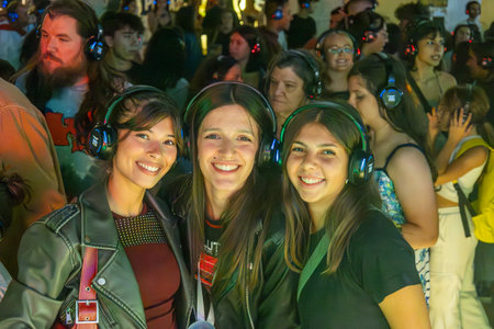 FARO, PORTUGAL: 5th SEPTEMBER, 2024 - Audience enjoying music in headphones on Festival F, a silent disco concept.のeditorial素材