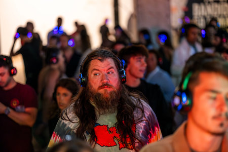 FARO, PORTUGAL: 5th SEPTEMBER, 2024 - Audience enjoying music in headphones on Festival F, a silent disco concept.のeditorial素材