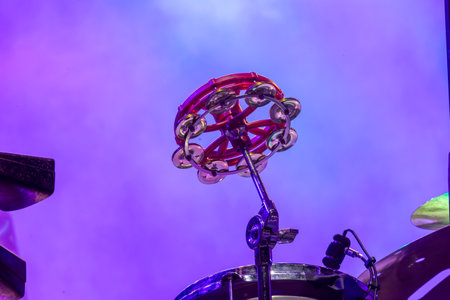 Close up view of a Tambourine musical instrument attached to a drum set.の写真素材
