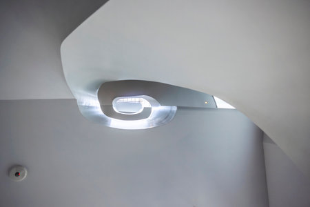 Close view of a interesting spiral staircase with several levels.