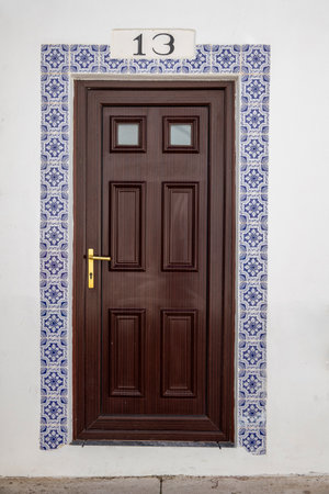 Close view of traditional door of vintage portuguese buildings.の写真素材