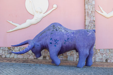 ESTOMBAR, PORTUGAL - 5th OCOTOBER 2024: Artistic plaster modern contemporary purple bull statue located on wine estate "Quinta dos Vales".のeditorial素材