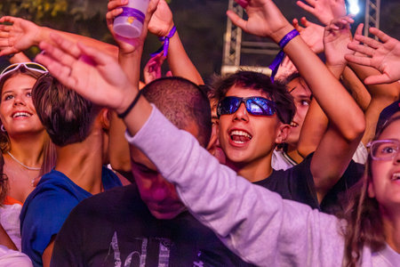 FARO, PORTUGAL: 5th SEPTEMBER, 2024 - Audience watch music artist in the Music Festival F, a big festival on the city of Faro, Portugalのeditorial素材