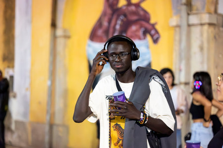 FARO, PORTUGAL: 5th SEPTEMBER, 2024 - Audience enjoying music in headphones on Festival F, a silent disco concept.のeditorial素材