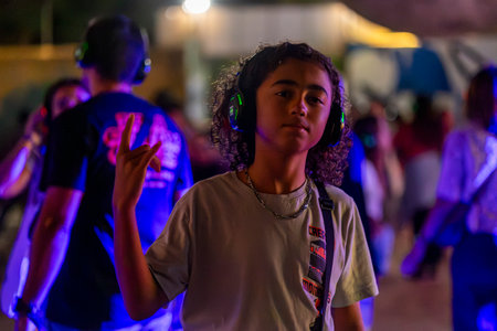 FARO, PORTUGAL: 5th SEPTEMBER, 2024 - Audience enjoying music in headphones on Festival F, a silent disco concept.のeditorial素材