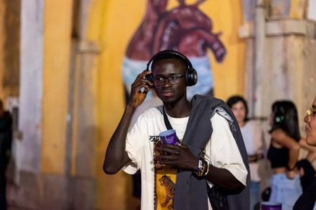 FARO, PORTUGAL: 5th SEPTEMBER, 2024 - Audience enjoying music in headphones on Festival F, a silent disco concept.のeditorial素材