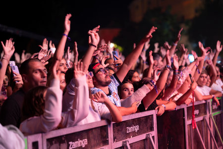 FARO, PORTUGAL: 5th SEPTEMBER, 2024 - Audience watch music artist in the Music Festival F, a big festival on the city of Faro, Portugalのeditorial素材