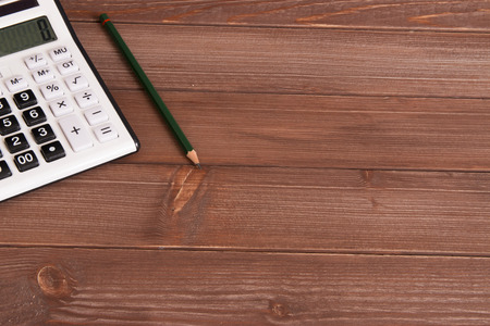 calculator and wood backgroundの写真素材