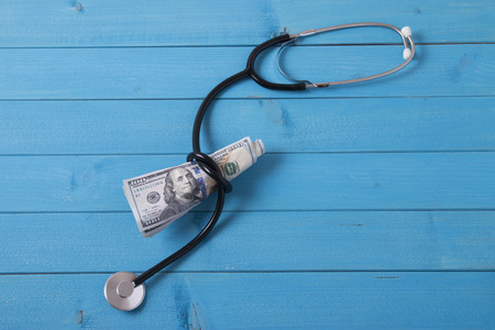 stethoscope and moneyの写真素材