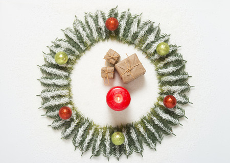 candle and gift box on the snowの写真素材