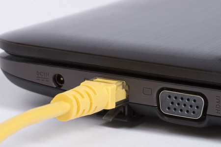 internet cable connected to computerの写真素材