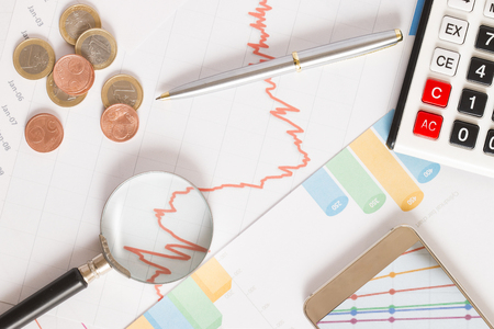 financial success charts and coinの写真素材